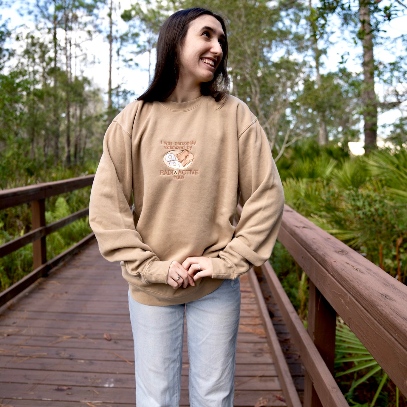 "Personally Victimized by Radioactive Eggs" embroidered crewneck